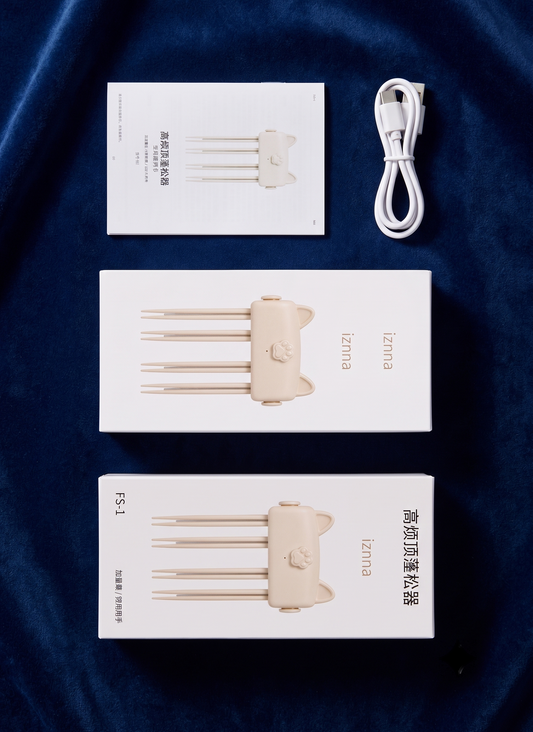 Three white product boxes for a set of four hair extension attachment needles, a white USB charging cable, and a small instruction card, arranged vertically on a dark blue velvet fabric background. The brand name 'Zenna' is visible on the packaging.