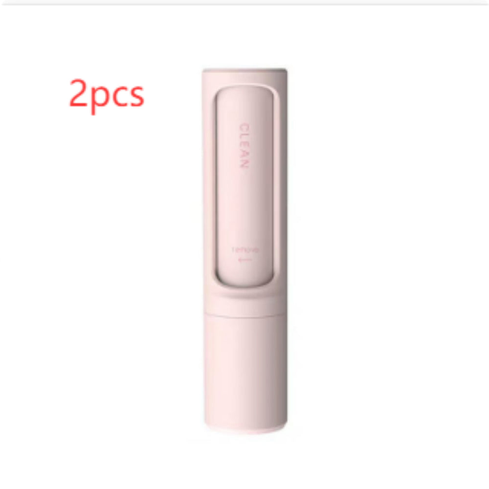 Two pink self-cleaning pet hair remover brushes designed for removing pet fur, lint, and fluff from clothing and furniture.