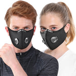 Two people wearing black face masks with valve designs on a white background