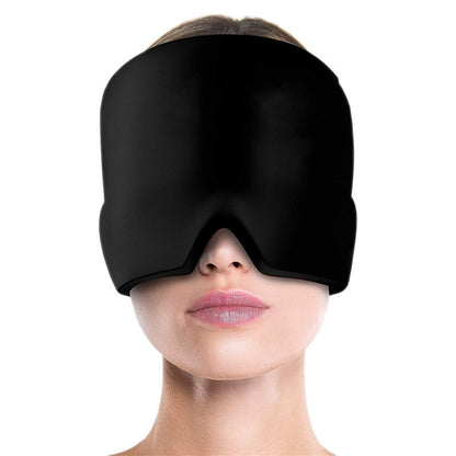 Black sleep mask worn by a person on a white background