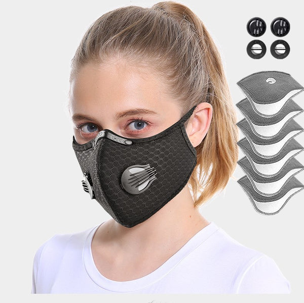 Person wearing a black mesh face mask with filter cartridges displayed on a white background