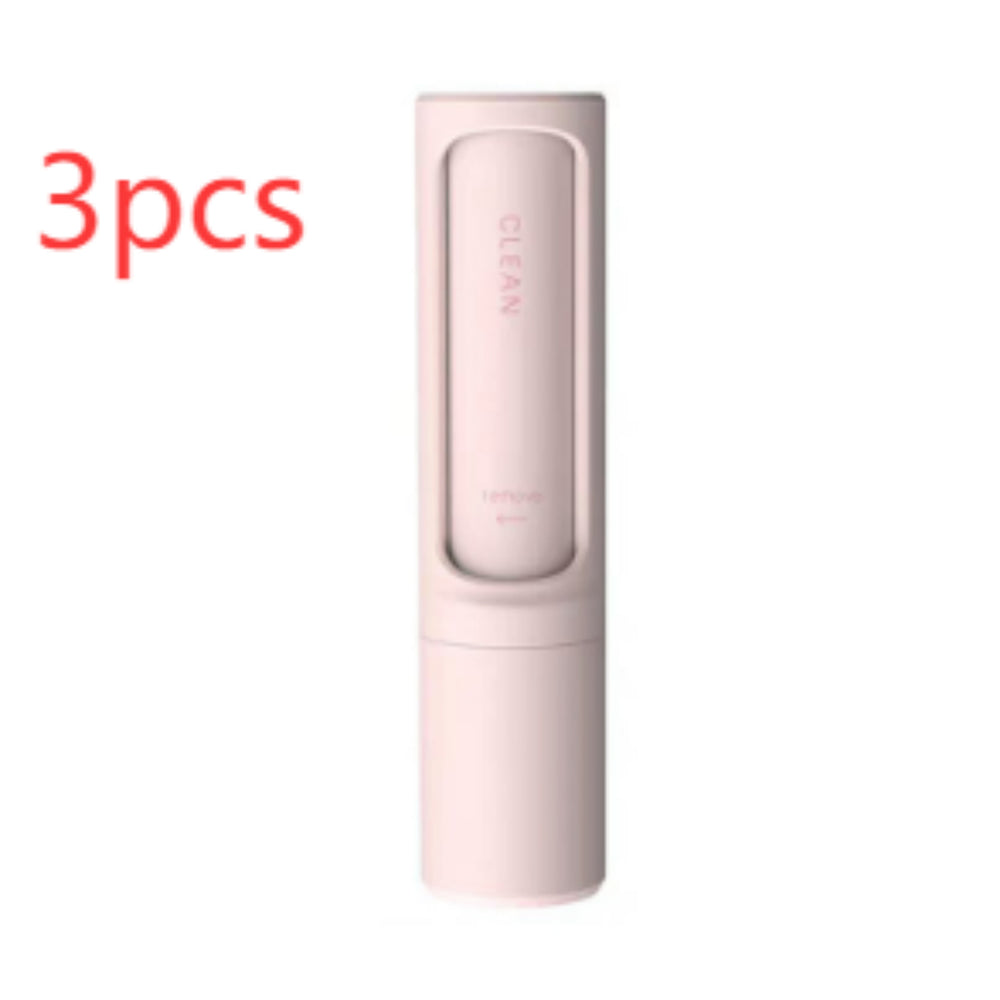Three pink self-cleaning pet hair remover brushes designed for removing pet fur, lint, and fluff from clothing, furniture, and bedding.