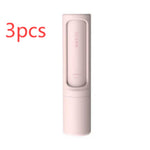 Three pink self-cleaning pet hair remover brushes designed for removing pet fur, lint, and fluff from clothing, furniture, and bedding.