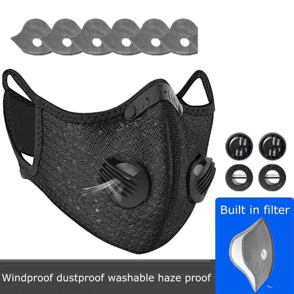 Black face mask with filter and replacement parts on a white background