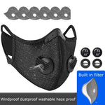 Black face mask with filter and replacement parts on a white background