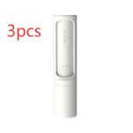 Three white self-cleaning pet hair remover brushes designed for removing pet fur, lint, and fluff from clothing, furniture, and bedding.