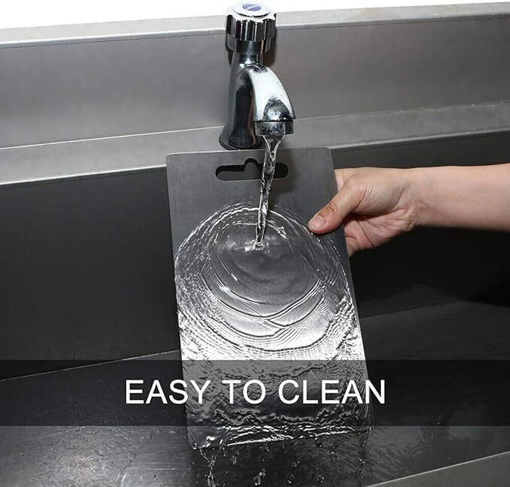Person washing a clear plastic card under running water from a faucet with 'EASY TO CLEAN' text displayed.