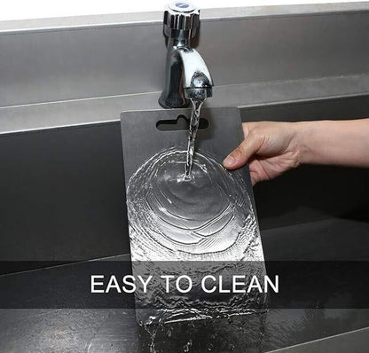 Person washing a clear plastic card under running water from a faucet with 'EASY TO CLEAN' text displayed.